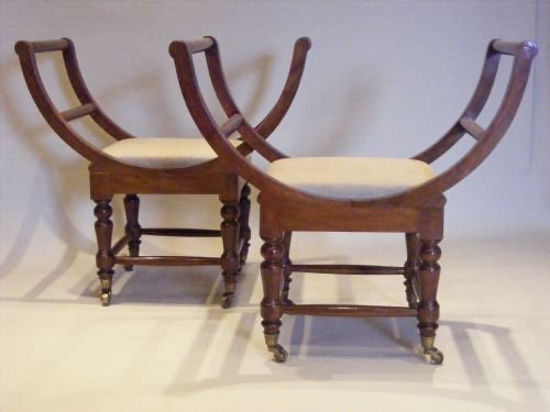 An Unusual Pair of Cherrywood Stools.