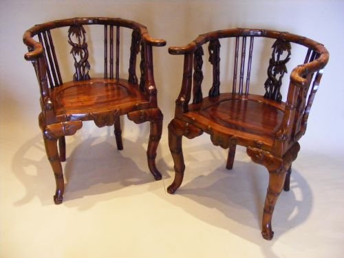 A Superb Pair of 19th Century Chinese Hardwood Arm Chairs.