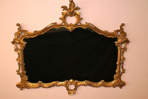Carved Wood and Gilt Wall Mirror.