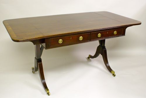 A George III Mahogany Sofa Table in the Gillows Manner.