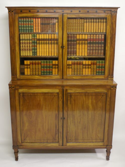 A Regency Pale Mahogany and Ebony Inlaid Bookcase Attributed to George Oakley.