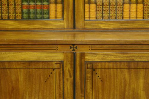 fig 1. A Regency pale Mahogany and Ebony inlaid bookcase attributed to George Oakley.