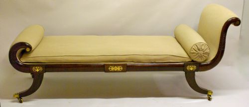 A Regency Mahogany and Brass Inlaid Chaise Lounge.