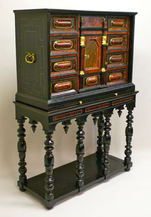 fig 1. A late 17th Century Flemish Tortoise shell and ebony cabinet on stand.