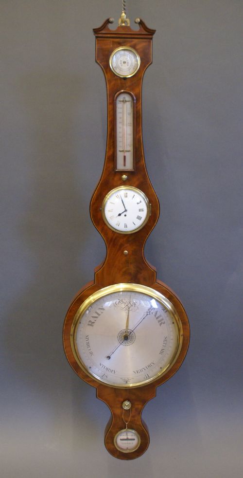 A Rare Mahogany Wheel Barometer and Clock by Graham, London.