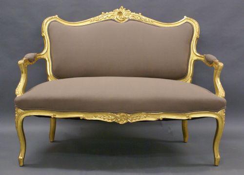 A Highly Decorative Venetian Carved Gilt Wood Sofa.