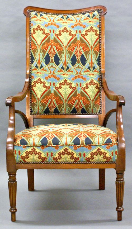 A Fine Art Nouveau Arm Chair with Liberty's Fabric Upholstery.