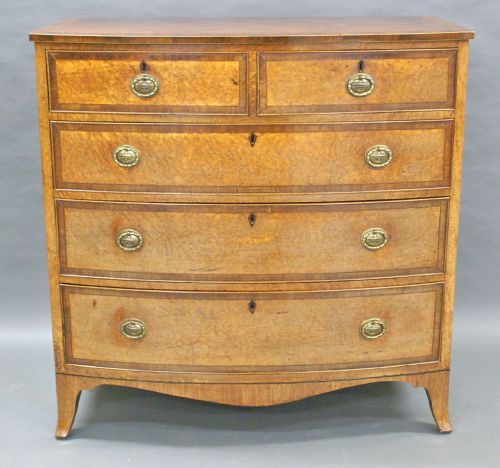 A Highly Unusual George III Birds Eye Maple Bow-fronted Chest of Drawers.