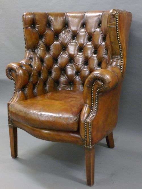 A Georgian Revival Leather Upholstered Barrel Back Arm Chair
