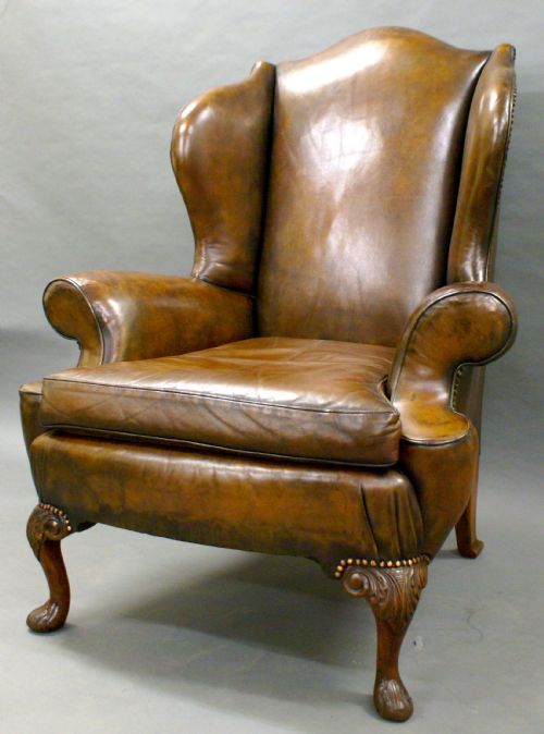 A Georgian Revival Leather Upholstered Wing Chair.