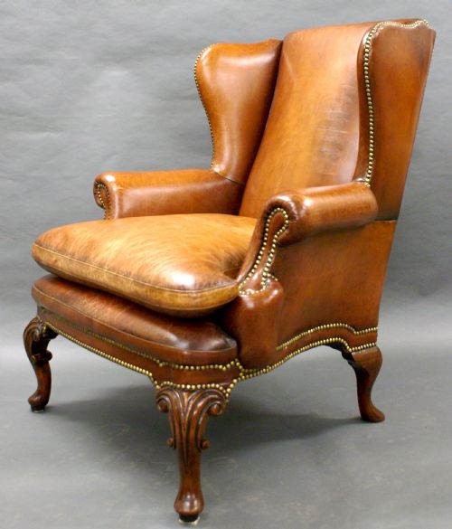 A Georgian Style Leather Upholstered Wing Chair