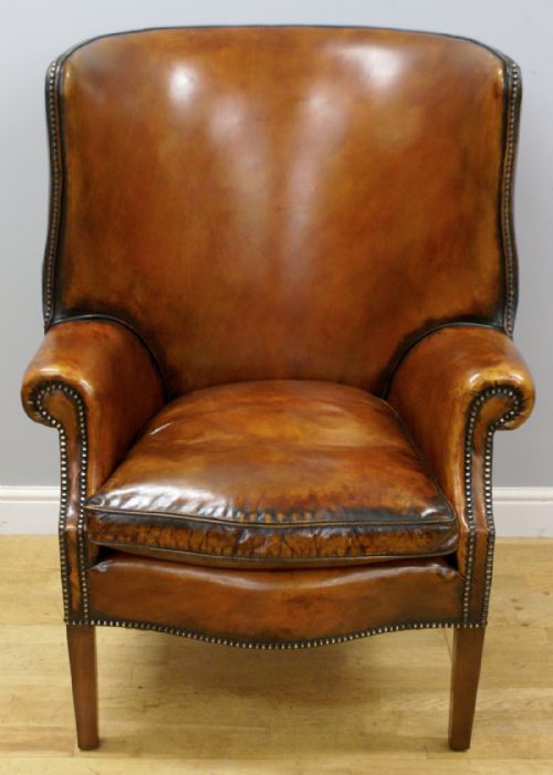 A Georgian Style Barrel Back Wing Chair