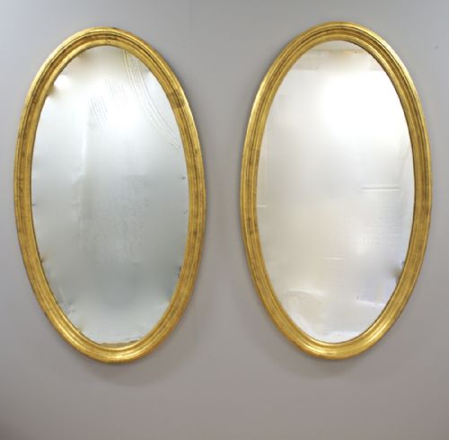 A Very Large Pair of Late 19th Century Oval Gilt Frame Mirrors.