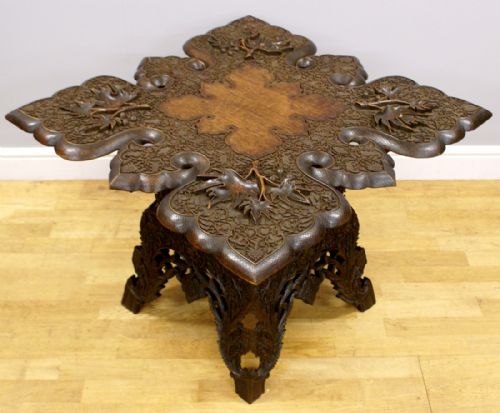 A Profusely Carved Indian Hardwood Table