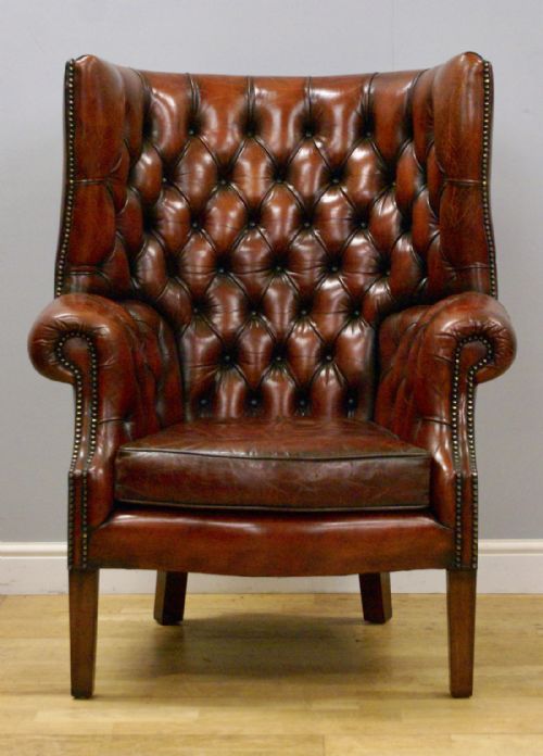 A Georgian Style, Barrel Back, Deep Buttoned Wing Chair