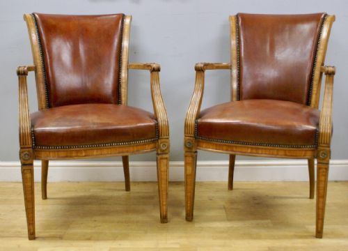 A Pair of Walnut Arm Chairs