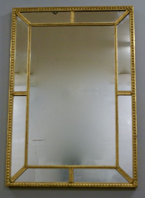 A Carved Wood and Gilt English Looking Glass