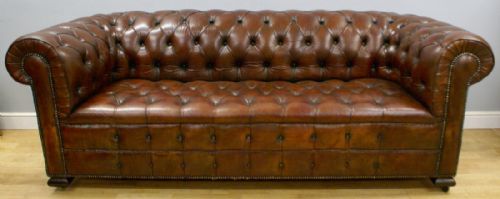 An Edwardian Leather Upholstered Chesterfield.