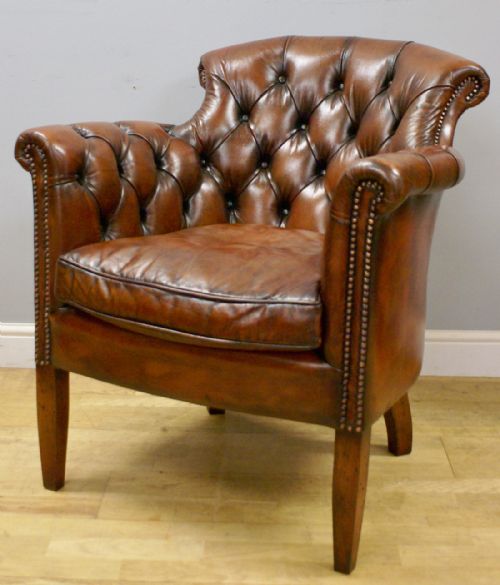 A Georgian Style Buttoned Leather Arm Chair