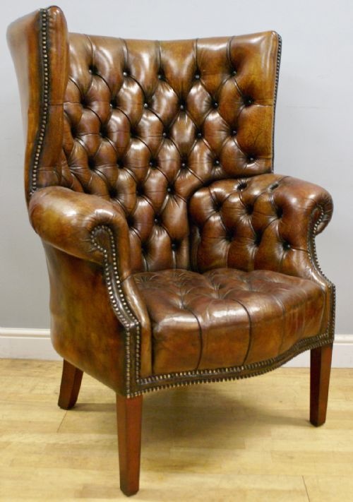 A Buttoned Leather Barrel Back Arm Chair