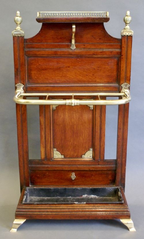 fig 1. An oak & brass stick stand by James Shoolbred.
