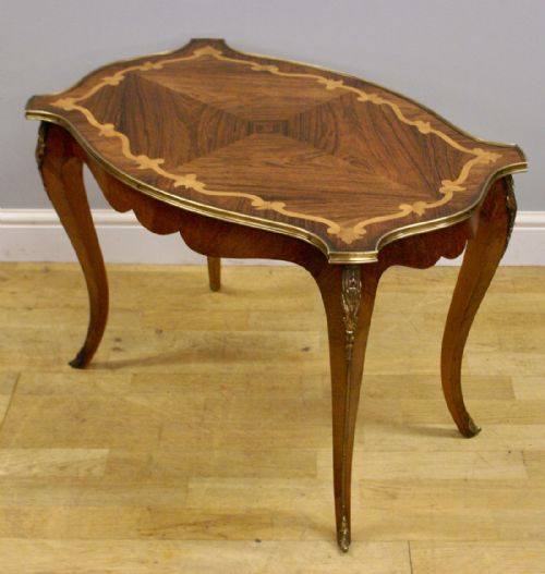 A Rosewood and Brass Coffee Table