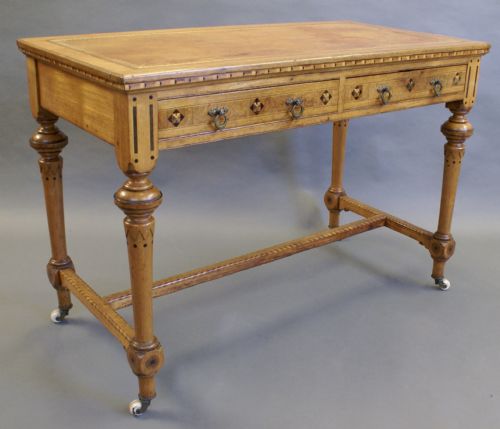An Arts & Crafts Inlaid Writing Table in the Manner of Shoolbred.
