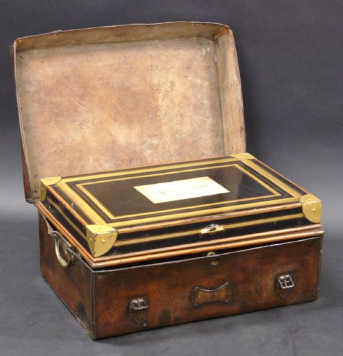 A Colonial Metal Dispatch Box in a Leather Case
