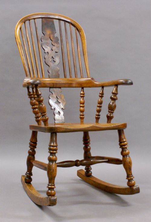 A 19th Century Yew Wood and Elm Rocking Chair