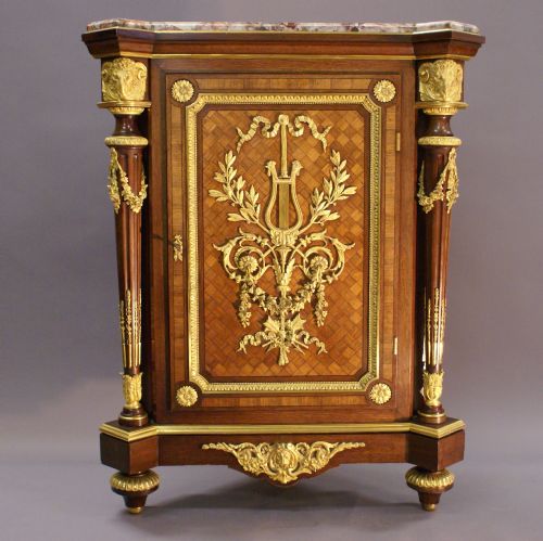 An Exceptional Ormolu Mounted Corner Cupboard