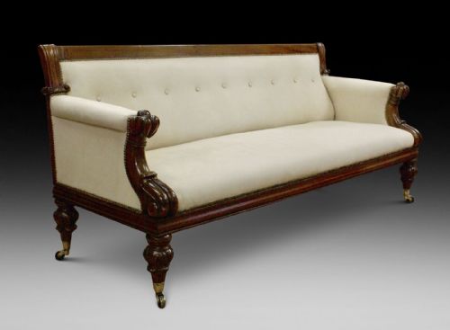 A Victorian Carved Mahogany Sofa