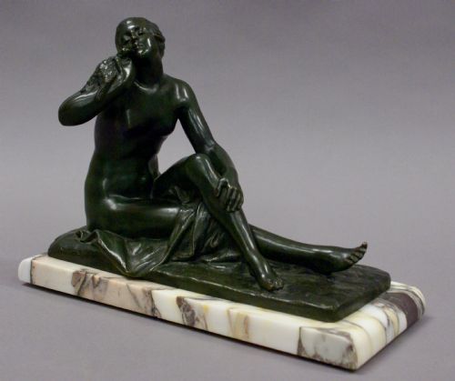 An Art Deco Bronze Figure Holding a Bird