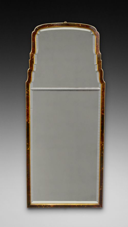 A Tortoise Shell Wall Mirror.
