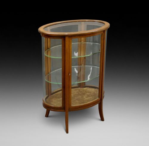 An Edwardian Oval Bijouterie Cabinet