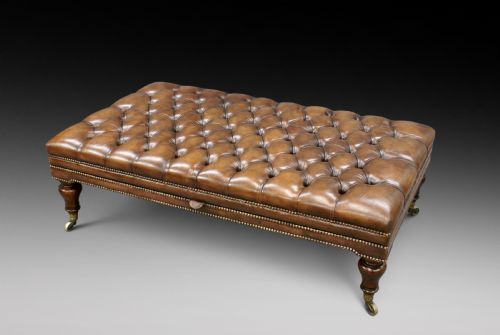 A Very Large Leather Upholstered Stool