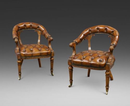 A Fine Pair of Walnut Library Arm Chairs