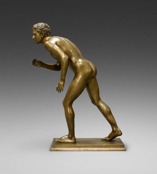 A Bronze Figure of a Running Male Nude