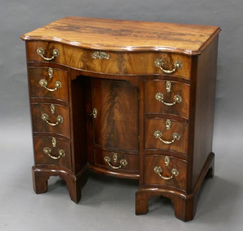 A RARE SERPENTINE KNEEHOLE DESK - ADDITIONAL PHOTO 2