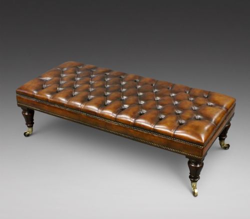 A Large Rosewood and Leather Upholstered Stool.