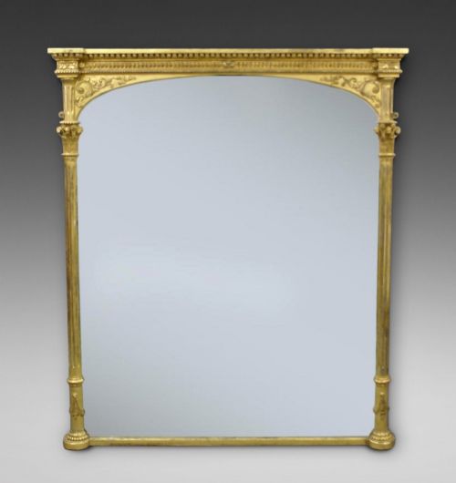 A Large Gilt Frame Over Mantle Mirror