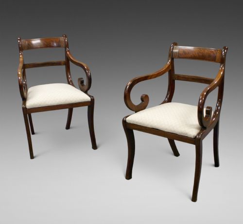 A Pair of Regency Mahogany Brass Inlaid Arm Chairs