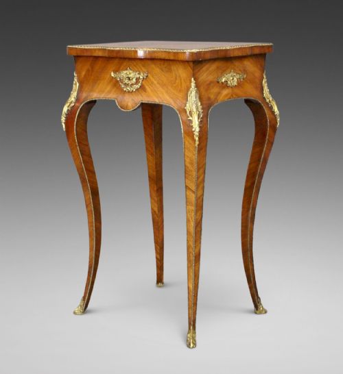 A French Tulipwood and Ormolu Table
