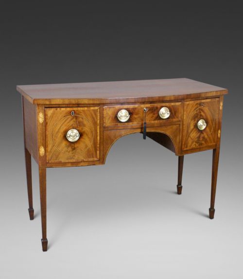 A GEORGE III FLAME MAHOGANY SIDEBOARD
