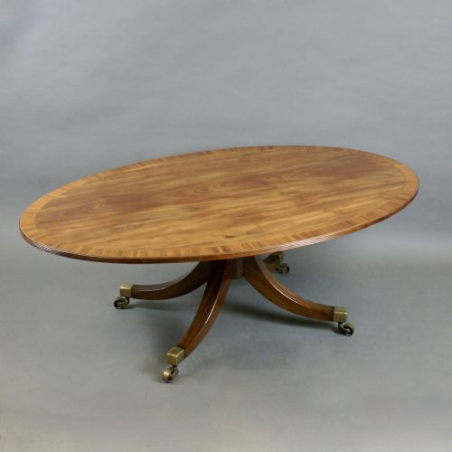 A LARGE OVAL FLAME MAHOGANY COFFEE TABLE - ADDITIONAL PHOTO 3