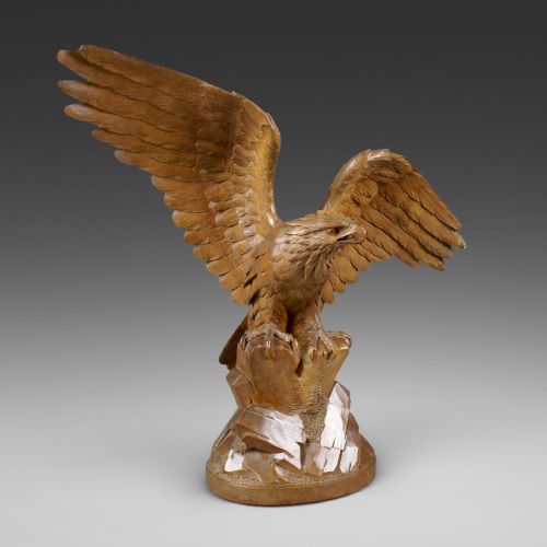 A Swiss 'Black Forest' Carved Linden Wood Eagle