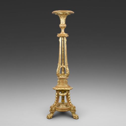 AN 18TH CENTURY STYLE CARVED GILT WOOD TORCHERE