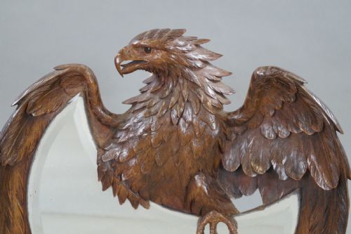 A FINELY CARVED BLACK FOREST MIRROR - ADDITIONAL PHOTO 1