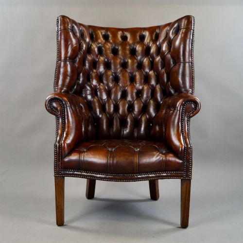A DEEP BUTTONED CHESTNUT BROWN BARREL BACK WING CHAIR - ADDITIONAL PHOTO 2