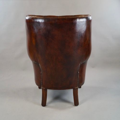 A DEEP BUTTONED CHESTNUT BROWN BARREL BACK WING CHAIR - ADDITIONAL PHOTO 3