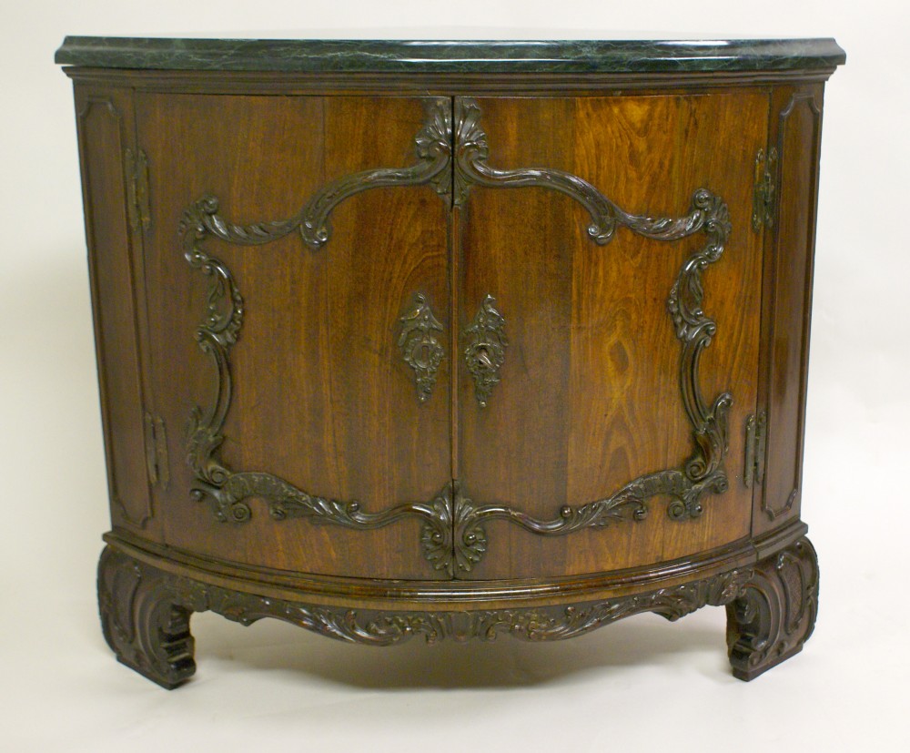 A rare Chippendale period carved mahogany corner cupboard